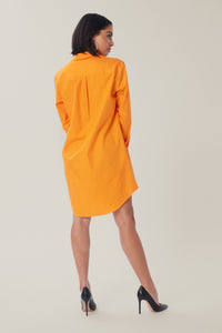 Cam is wearing a size S Oversized Shirt Dress in Cotton in color Pop Orange by LITA, view 5