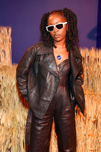 Maya is wearing a size S Spellbound Leather Jumpsuit in Leather in color Black by LITA, view 9