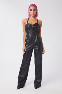 Cam is wearing a size XS Spellbound Leather Jumpsuit in Leather in color Black by LITA, view 2