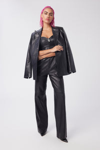 Cam is wearing a size XS Spellbound Leather Jumpsuit in Leather in color Black by LITA, view 6