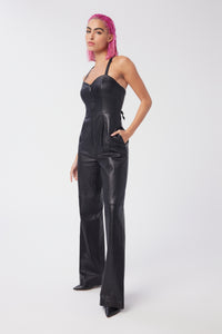 Cam is wearing a size XS Spellbound Leather Jumpsuit in Leather in color Black by LITA, view 3