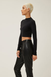 Bella is wearing a size s Young & Fun Long Sleeve Crop Mock Top in Rayon in color Black by LITA, view 7