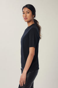Annaly is wearing a size S Boxy Shoulder Pad Tee in Cotton in color Black by LITA, view 3
