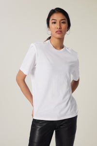 Annaly is wearing a size S Boxy Shoulder Pad Tee in Cotton in color White by LITA, view 17