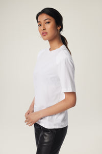 Annaly is wearing a size S Boxy Shoulder Pad Tee in Cotton in color White by LITA, view 19