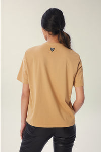 Annaly is wearing a size S Boxy Shoulder Pad Tee in Cotton in color Iced Coffee by LITA, view 15
