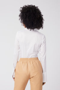 Imoni is wearing a size S Connection Woven Shirt in Cotton in color White by LITA, view 5