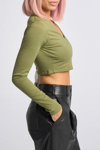 Cam is wearing a size XS Long Sleeve Jaguar Tee in Cotton in color Olive by LITA, view 14
