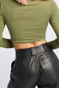 Cam is wearing a size XS Long Sleeve Jaguar Tee in Cotton in color Olive by LITA, view 15