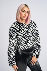 Cam is wearing a size XS Sweatshirt in Faux Fur in color Zebra Print by LITA, view 2