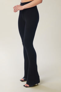 Annaly is wearing a size S True Rib Pant in color Black by LITA, view 4