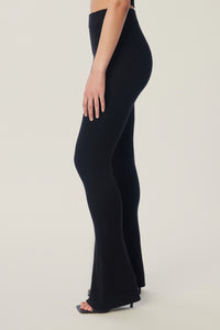 Annaly is wearing a size S True Rib Pant in color Black by LITA, view 5