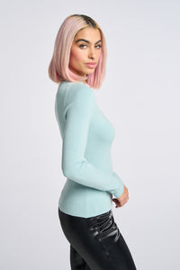 Cam is wearing a size XS Peek Shoulder Sweater in Viscose in color Artic Blue by LITA, view 3