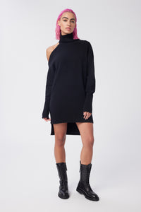 Cam is wearing a size XS Cold Shoulder Mock Neck Sweater Tunic in Cotton and Cashmere in color Black by LITA, view 1