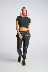 Cam is wearing a size XS Jogger in Leather in color Black by LITA, view 9