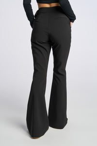 Model is wearing a size 0 Flared Leg Suit Pant in Crepe in color Black by LITA, view 9