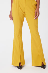 Model is wearing a size 0 Flared Leg Suit Pant in Crepe in color Saffron by LITA, view 5