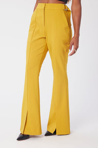 Model is wearing a size 0 Flared Leg Suit Pant in Crepe in color Saffron by LITA, view 1