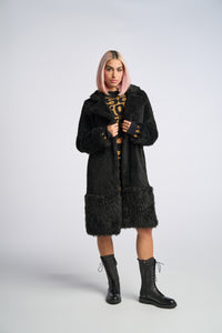 Cam is wearing a size XS The Teddy Coat in Faux Fur in color Black by LITA, view 5
