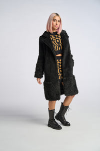 Cam is wearing a size XS The Teddy Coat in Faux Fur in color Black by LITA, view 6