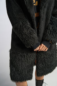 Cam is wearing a size XS The Teddy Coat in Faux Fur in color Black by LITA, view 9