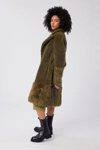 Imoni is wearing a size S The Teddy Coat in Faux Fur in color Olive by LITA, view 4