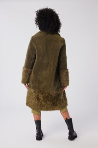 Imoni is wearing a size S The Teddy Coat in Faux Fur in color Olive by LITA, view 5