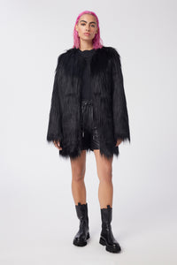 Cam is wearing a size S The Shag Faux Fur Coat in color Black by LITA, view 1