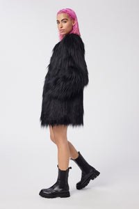 Cam is wearing a size S The Shag Faux Fur Coat in color Black by LITA, view 3