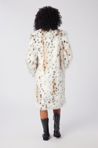 Imoni is wearing a size S Amour Coat in Snow Leopard Faux Fur in color Snow Leopard by LITA, view 4