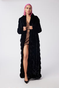 Cam is wearing a size S The Encore Coat in Faux Fur in color Black by LITA, view 1