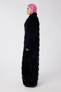 Cam is wearing a size S The Encore Coat in Faux Fur in color Black by LITA, view 3