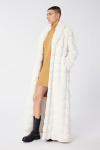 Maya is wearing a size S The Encore Coat in Faux Fur in color White by LITA, view 11