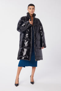 Maya is wearing a size S Puffer Coat in Leather in color Black by LITA, view 6