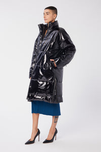 Maya is wearing a size S Puffer Coat in Leather in color Black by LITA, view 7