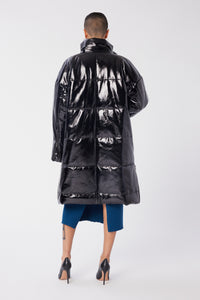 Maya is wearing a size S Puffer Coat in Leather in color Black by LITA, view 9