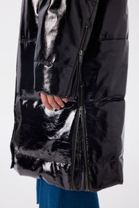 Maya is wearing a size S Puffer Coat in Leather in color Black by LITA, view 12