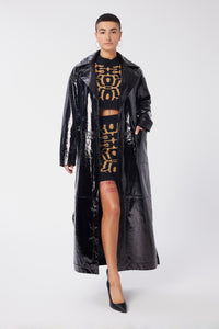 Maya is wearing a size S Trench Coat in Glazed Leather in color Black by LITA, view 4