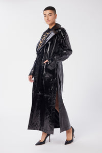 Maya is wearing a size S Trench Coat in Glazed Leather in color Black by LITA, view 2