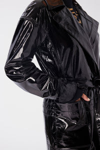 Maya is wearing a size S Trench Coat in Glazed Leather in color Black by LITA, view 6