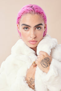 Cam is wearing a size S The Encore Coat in Faux Fur in color White by LITA, view 16